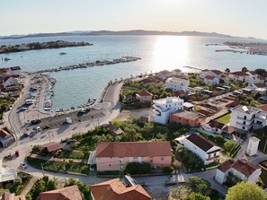 Body Of Water, Coast, Coastal And Oceanic Landforms, Waterway, Sea, Residential Area, Shore, Channel, Beach, Boat