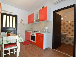 Cabinetry, Countertop, Furniture, Kitchen, Building, Window, Sink, Kitchen Stove, Orange, Wood