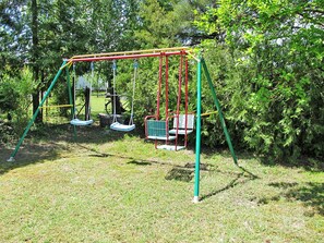 Plant, Tree, Grass, Playground, Shade, Leisure, Chute, Recreation, Outdoor Play Equipment, Shrub