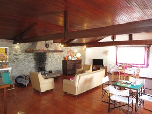Couch, Furniture, Picture Frame, Interior Design, Building, Living Room, Television, Table, Houseplant, Floor