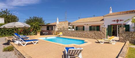 Sky, Cloud, Building, Property, Swimming Pool, Azure, House, Outdoor Furniture, Shade, Sunlounger