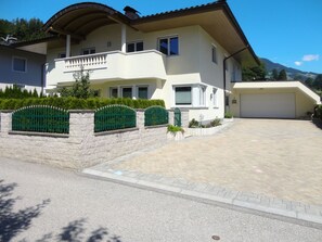 Sky, Building, Plant, Window, House, Shade, Land Lot, Road Surface, Door