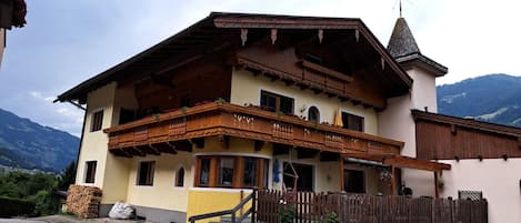 Plant, Sky, Building, Property, Window, Cloud, Mountain, Wood, House