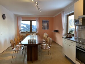 Furniture, Table, Cabinetry, Countertop, Window, Chair, Wood, Home Appliance, Lighting, Kitchen