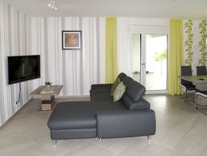 Furniture, Living Room, Room, Property, Interior Design, Floor, Wall, Couch, Building, Real Estate