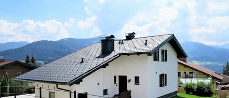 Cloud, Sky, Building, Plant, Window, Property, Mountain, Tree, House, Natural Landscape