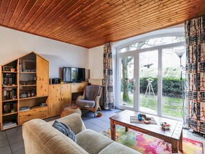 Furniture, Property, Couch, Wood, Bookcase, Building, Interior Design, Lighting, Living Room, Window