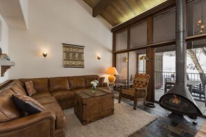 Living Room - Ample Seating, Large Windows, and Fireplace