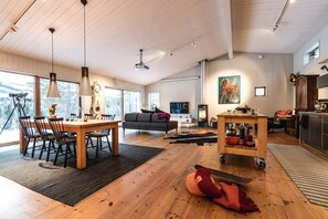 Dining area and living room with fire place.