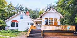 Front of house with large deck porch