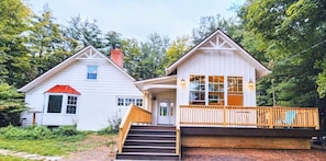 Front of house with large deck porch