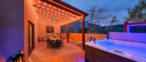 Outdoor dining area with private hot tub!