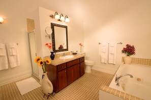 Full spa bathroom with Jacuzzi tub and separate dual shower.