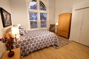 Bedroom with a queen-sized bed. (2)