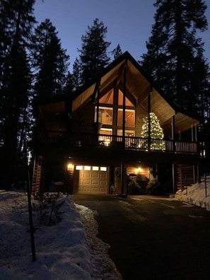 December guests enjoy a lighted Christmas tree on the deck