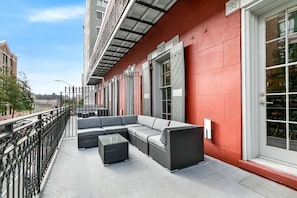 Extra deep balcony with cozy sectional and coffee table. Perfect for morning and evening relaxing!