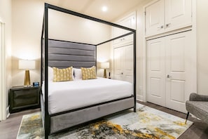 Spacious master bedroom featuring a king size bed with an ensuite bathroom and designer built in closets. The bedroom is equipped with night stands, lamps, hangers, luggage racks, alarm clock, white noise machine and a 55'' Samsung Smart 4K TV that allows for streaming from your favorite apps, along with the DIRECTV Entertainment.