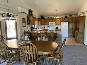 Dining room open to the kitchen and living room.