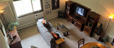 Two-story loft design with a master suite on the top floor.