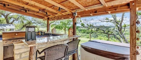 Enjoy incredible views of Hill Country that go on for miles all from our hot tub