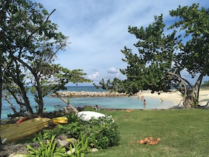 Main beach offers shallow swimming and snorkeling around the rock wall.