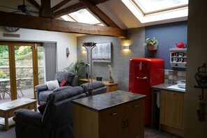 The lounge with velux windows making the living area bright and airy.