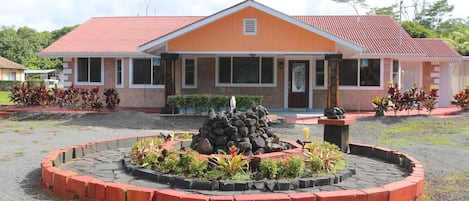 Front view of the house and circular driveway