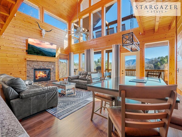 The living room features a gas fire place and views for days!