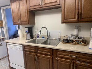 Renovated kitchen with new microwave and 5 burners range.