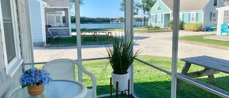 Screened-in porch with view of Bass River