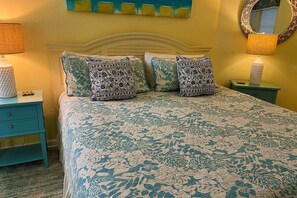 Coastal inspired king master bedroom suite with master bathroom.