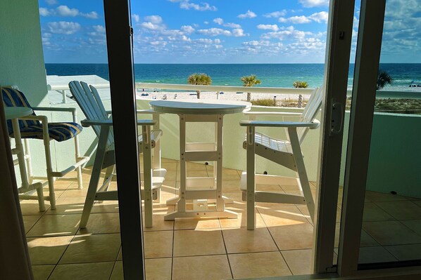 Gorgeous balcony view of the gulf with seating for morning coffee or a meal.