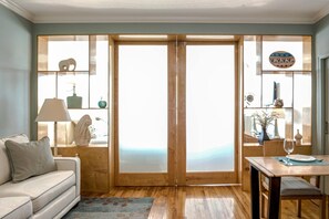 Queen Pull out. Sliding door to the bedroom. Dining area at the right hand side