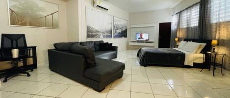 Big space with sitting, work station, queen side bed, smart TV, air-conditioned