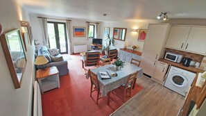 Living area on lower ground floor with French Windows opening out to large lawn.