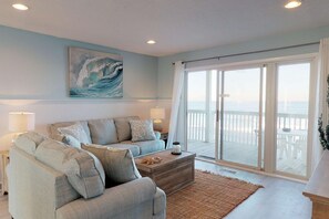 Enjoy the ocean view from the main living space.  Sand Castle has been updated with new floors, furniture, paint and appliances