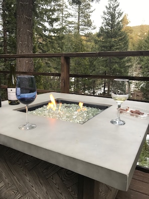 Fire table on the deck overlooking the river