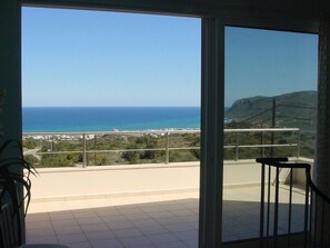 View from 1st floor bedroom breakfast on the terrace has table and chairs.