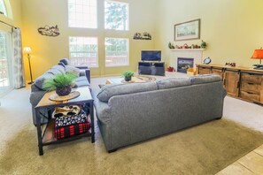 The sofa bed on the left is a queen-sized sofa bed in the living room.