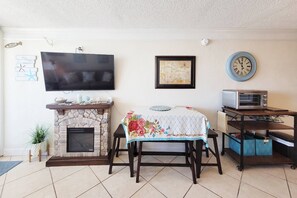 50" flat screen TV, faux operating fire place and dinette.