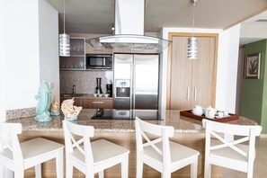 full kitchen includes washer and dryer.