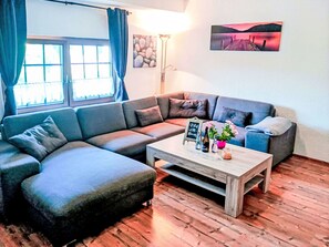 Couch, Furniture, Property, Blue, Azure, Window, Lighting, Interior Design, Purple, Living Room