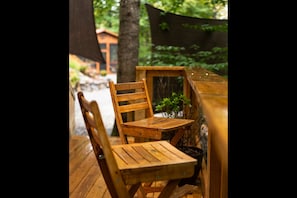 Lower deck dining nook with Tiny Cabin in the distance