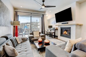 Luxurious Living Room Adorned With 55" HD TV Situated Above The Gas Fireplace