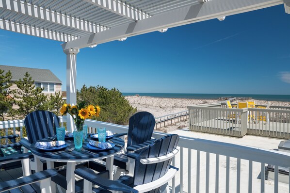 Outdoor dining under a pergola that closes with the push of a button!