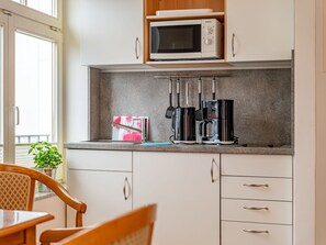 Cabinetry, Furniture, Countertop, Window, Kitchen, Plant, Building, Wood, Drawer, Shelving