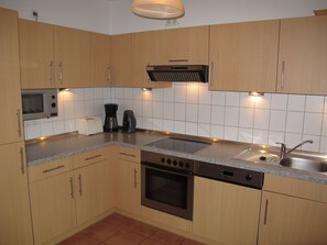 Cabinetry, Countertop, Property, Kitchen Sink, Sink, Tap, Kitchen Stove, Kitchen Appliance, Kitchen, Building