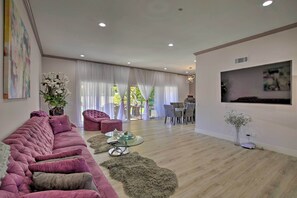 The modern home features 3 bedrooms, 3 bathrooms, and space for 6.