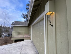 Private lane leading to two-car garage, right by biking trails.