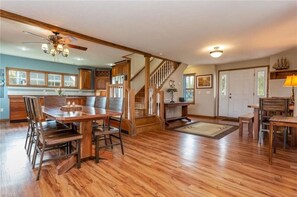 Open Floor Plan Common Area with 2 dining tables.